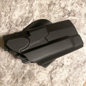Safariland Sig P320 retention holster with leg paddle.